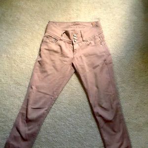 three buttons tan Jean pants